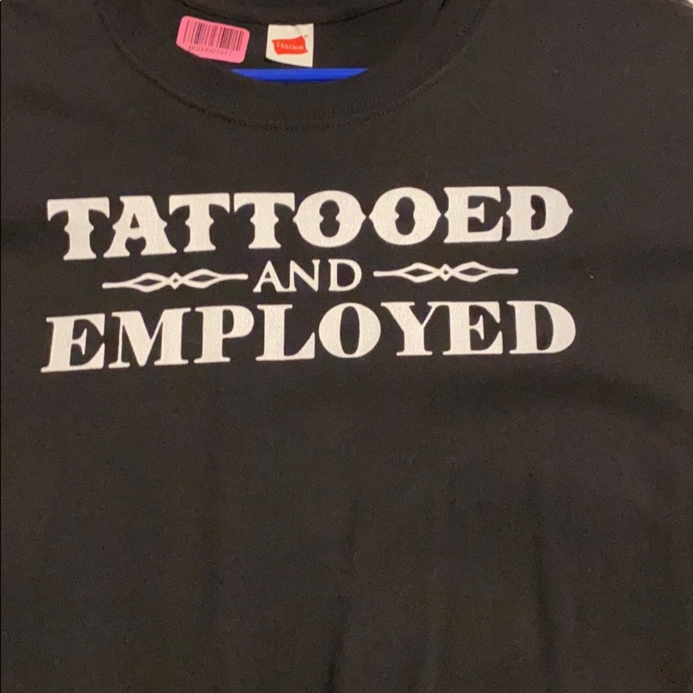 Tattooed employeed tee